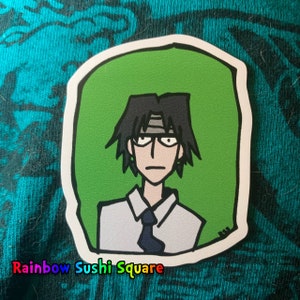 May include: A sticker featuring a cartoon illustration of a person with black hair, wearing a white shirt and a dark blue tie. The person has a serious expression and is wearing a white headband. The background is green.