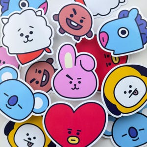 Könnte beinhalten: Eine Sammlung farbenfroher Cartoon-Charakter-Aufkleber. Die Aufkleber zeigen verschiedene Designs, darunter ein rosa Kaninchen, ein rotes Herz, ein blauer Koala und ein gelber Kreis. Die Aufkleber befinden sich auf einem weißen Hintergrund.