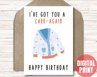 May include: A white card with a blue and white cartoon sweater and the text "I've got you a card-again Happy Birthday".