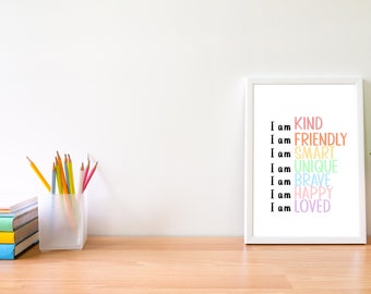 May include: A white framed print with the text "I am KIND", "I am FRIENDLY", "I am SMART", "I am UNIQUE", "I am BRAVE", "I am HAPPY", "I am LOVED" in rainbow colors.