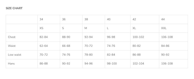 May include: Size chart for clothing with measurements in inches for chest, waist, low waist, and hips. Sizes range from XS to XXL.