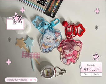 May include: A collection of anime-style keychains, a handheld game, and star-shaped accessories. The keychains feature colorful character illustrations. The image also includes a reminder with the text "#LOVE".