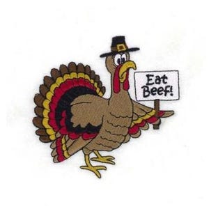 May include: A cartoon turkey wearing a pilgrim hat holds a sign that says "Eat Beef!" The turkey is brown with red, yellow, and black feathers.