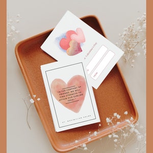 May include: Two Valentine's Day cards with watercolor hearts. One card has a quote about the strength of friendship by St. Maximilian Kolbe. The other card is a blank card with space to write "To:" and "From:".