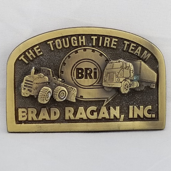 Vintage Brass Brad Ragan Inc. Belt Buckle: The Tough Tire Team