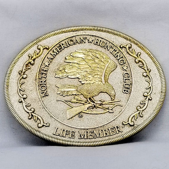 North American Hunting Club Belt Buckle – Eagle with Rifle & Shotgun Life Member