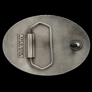 May include: Oval-shaped, solid pewter belt buckle with a textured surface. The buckle features a rectangular bar and a metal loop for the belt. The text "SOLID PEWTER MADE IN USA" is stamped on the buckle.