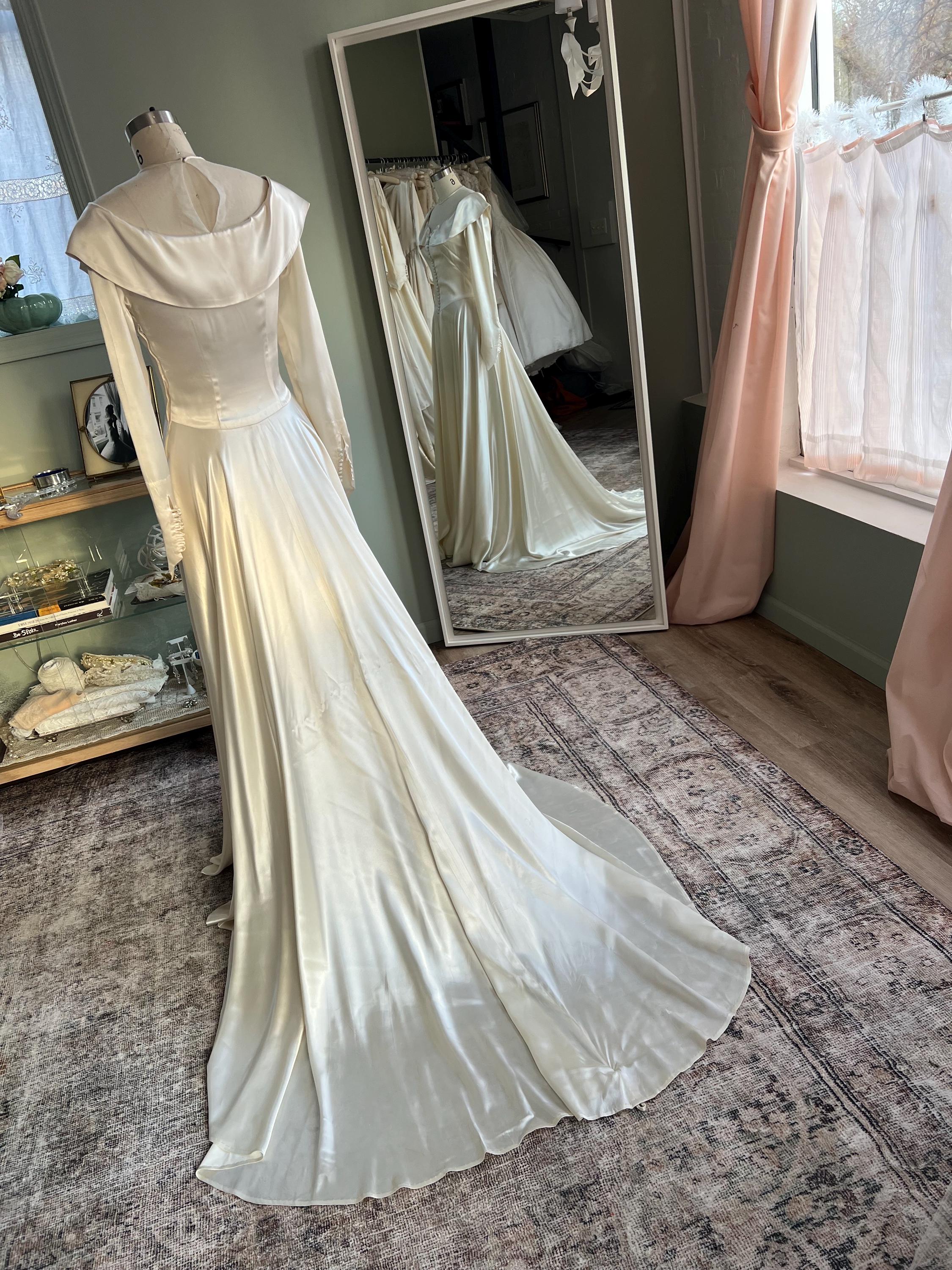old hollywood wedding dress F221055 Stretch Soft Crepe Fit and Flare Bishop Sleeve Gown with Asymmetrical Draped Waist and Keyhole Back this dress provides a sleek and polished look 1940s Liquid Satin Charmeuse Vintage