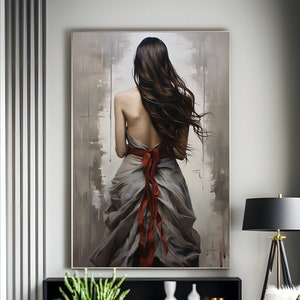 May include: A painting of a woman in a flowing grey dress with a red ribbon tied around her waist. The woman is standing with her back to the viewer and her long brown hair is flowing in the wind. The painting is set against a background of muted grey and brown tones.