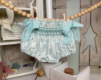 3-6m - 17" waist - Hand smocked bloomers/diaper cover. Beautiful aqua floral print with chiffon bows. Unique. Ready to Ship!