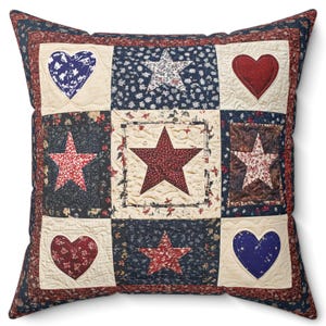 May include: A red, white, and blue patchwork pillow with stars and hearts. The pillow is made of cotton fabric and has a quilted design.