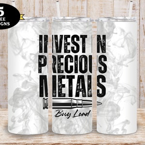 May include: Three white stainless steel tumblers with a black and white design. The design features the text "Invest in Precious Metals" and a bullet with the text "Buy Lead" underneath. The background is a white marble pattern.