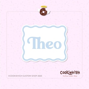 May include: A light pink background with a white rectangle featuring the name "Theo" in light blue. A brown donut with angel wings and a halo is at the top. The Cookiehigh Custom Shop logo is at the bottom.