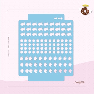 May include: A blue cookie cutter stencil with a design of fish and circles. The stencil is on a pink background with white polka dots. The text "COOKIEHIGH CUSTOM COOKIE SHOP" is on the left side of the stencil and the text "COOKIEHIGH" is on the right side of the stencil.