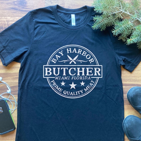 T-shirt humoristique parodiant le logo d'une boucherie floridienne, T-shirt graphique effet vieilli « Prime Quality Cuts », Cadeau original « Couteau de boucher côtier »