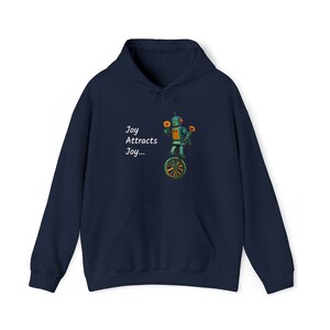May include: Navy blue hooded sweatshirt with a white graphic of a robot riding a unicycle and the text "Joy Attracts Joy..."