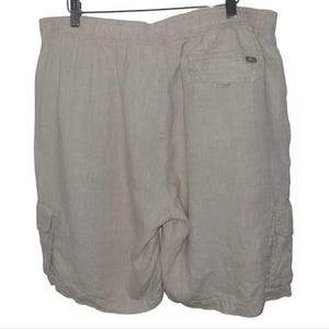 May include: A pair of light gray linen cargo shorts with a drawstring waist and two side pockets.