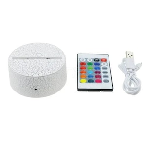 May include: White round LED lamp base with a cracked texture, a remote control with 16 color options, and a USB cable.