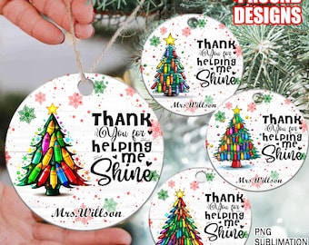 May include: Four round sublimation designs for ornaments featuring a Christmas tree decorated with colorful crayons. The text on each ornament reads "Thank You for helping me shine" with the name "Mrs. Willson" at the bottom.