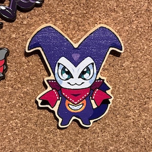 May include: A purple and red cartoon character with a red bandana and a white circle on its chest. The character is made of wood and has a glossy finish.