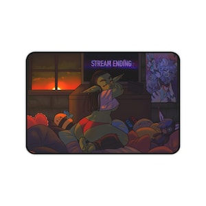 May include: A green-skinned character with purple hair and large ears is lying on a bed with pillows and stuffed toys. The character is wearing a red and green outfit and is looking at a computer screen that says "STREAM ENDING".