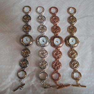 Women&#39;s number dial silver, gold, rose gold, silver and gold 5 point star toggle closure  casual watches