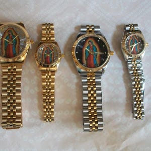 May include: Four wristwatches with gold and silver bands. Each watch face features a colorful image of a religious figure.