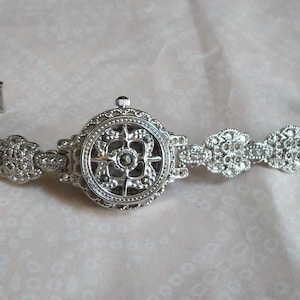 Women's Marcasite Look  Silver finish dressy casual fashion watch and Covered face  for 7.1 Inches Watch. Toggle