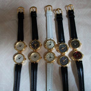 Women&#39;s black, silver, red, mother of pearl dial gold finish black and white leather band 2 time zone dual time fashion travel fun watch