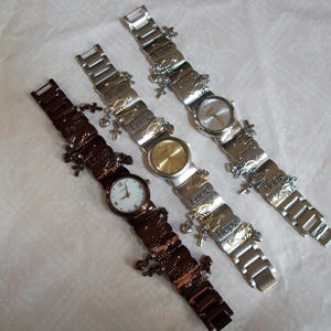 Women's Silver, gold and bronze finish Love, Faith Hope and dangling heart & cross charm fashion watch bracelet