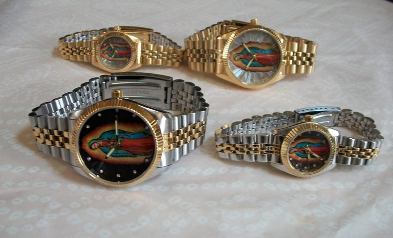 May include: Four wristwatches with gold and silver bands. Each watch face features a colorful image of the Virgin Mary.