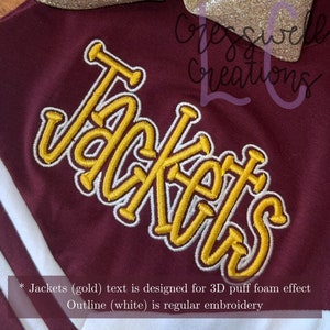 May include: Embroidered "Jackets" text in gold with a white outline. The text is designed for a 3D puff foam effect. The outline is regular embroidery.