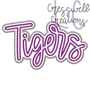 May include: A purple and white graphic that says "Tigers" in a cursive font. The word is outlined in white and gray. The text "cresswell creations" is written above the word "Tigers" in a cursive font.