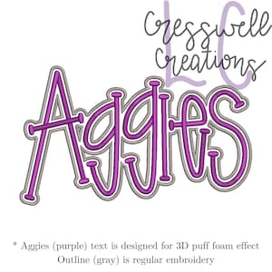 May include: Purple "Aggies" text with a grey outline. The text is designed for a 3D puff foam effect. The outline is regular embroidery.