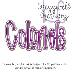 May include: Purple embroidery design of the word "Colonels" with a gray outline. The text is designed for a 3D puff foam effect. The outline is regular embroidery.