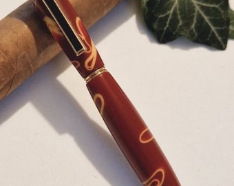 stylish hand-turned ballpoint pen made of acrylic resin in gold.
