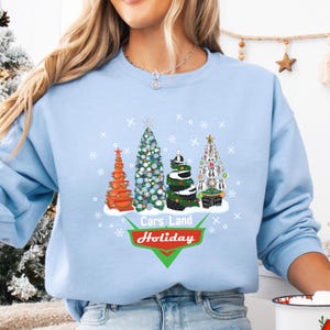 Cars Land Christmas Trees Sweatshirt, Radiator Springs Holiday Crewneck, Cozy Cone Motel/Flos V8 Cafe Winter Unisex Crewneck, Disney Pixar