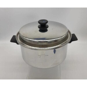 May include: A stainless steel cooking pot with a matching lid and two black side handles. The pot features a polished metallic finish and a central black knob on the lid. The design includes a cylindrical body with a flat base and a secure lid.