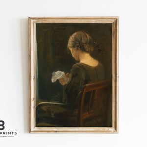 May include: A framed oil painting of a woman sitting in a chair, wearing a dark dress and holding a white cloth. The painting is set against a dark background.