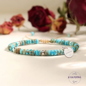 May include: A turquoise and brown beaded bracelet with a silver charm that says "JOSEPHINE".