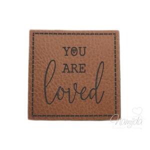 1 piece - SOFT KuNSTLEDER LABEL - YOU aRE loved - Patch with pre-printed sewing seam - 40 mm x40mm (8F)