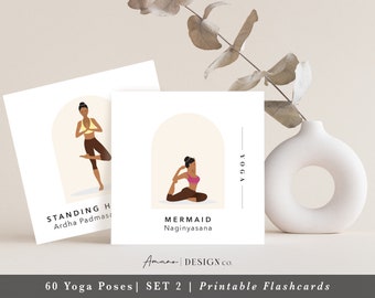 May include: Two printable yoga flashcards featuring illustrations of women in different poses. The first card shows a woman in the Ardha Padmasana pose, with the text "STANDING HALF LOTUS" and "Ardha Padmasana". The second card shows a woman in the Naginyasana pose, with the text "MERMAID" and "Naginyasana". Both cards have a light brown background with a cream-colored archway.