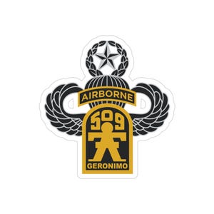 May include: A sticker displaying the 509th Airborne Infantry Regiment emblem. The design incorporates a star, wreath, parachute, and wings, with the words "AIRBORNE" and "GERONIMO" in gold and black.