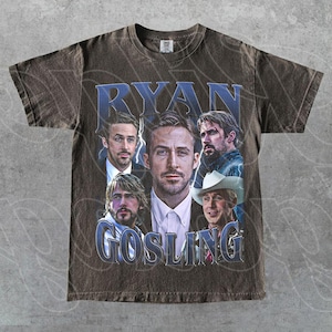 May include: Brown t-shirt featuring multiple images of Ryan Gosling with the text "RYAN GOSLING" in a blue, vintage-style font. The shirt has a distressed look.