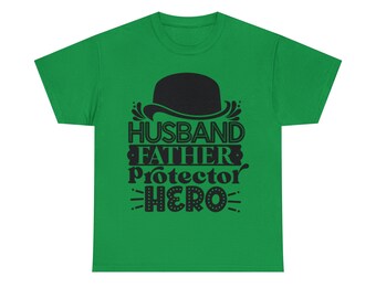 May include: A green t-shirt with the words "HUSBAND FATHER PROTECTOR HERO" in black, along with a black bowler hat graphic. The shirt is a solid color and has a crew neck.