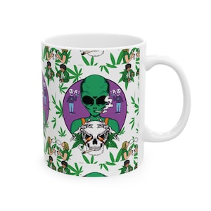 May include: White ceramic mug with a green alien smoking a joint and holding a skull. The mug has a repeating pattern of green marijuana leaves, aliens, and people smoking joints.
