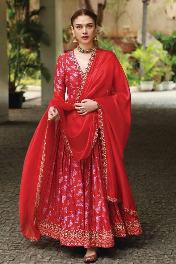 aditi rao hydari red dress Aditi Rao Hydari wore the iconic Sabyasachi red co-ord set, proving that red is the standout choice of the season