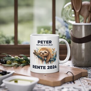 May include: White ceramic mug with a sloth illustration and the text "Peter muss gar nichts mehr! Rente 2024".