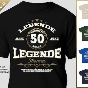 May include: Black t-shirt with a gold graphic that says "LEBENDE 50 JAHRE JUNG LEGENDE Thomas" with a gold star design. The text "LIMITIERTE AUFLAGE" is in a circle around the number 50. The text "PREMIUM QUALITAT MADE IN GERMANY SO JAHRE ZUR PERFEKTION GEREIFT" is at the bottom of the graphic.