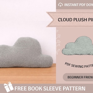 May include: A gray cloud-shaped plush pillow sits on a wooden surface. The pillow has a soft, textured appearance. The image also includes text that reads "CLOUD PLUSH PILLOW", "PDF SEWING PATTERNS", and "BEGINNER FRIENDLY".